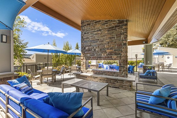 Cozy fire pit area on patio at Lakeview at Newcastle Apartments with comfortable seating for outdoor gatherings