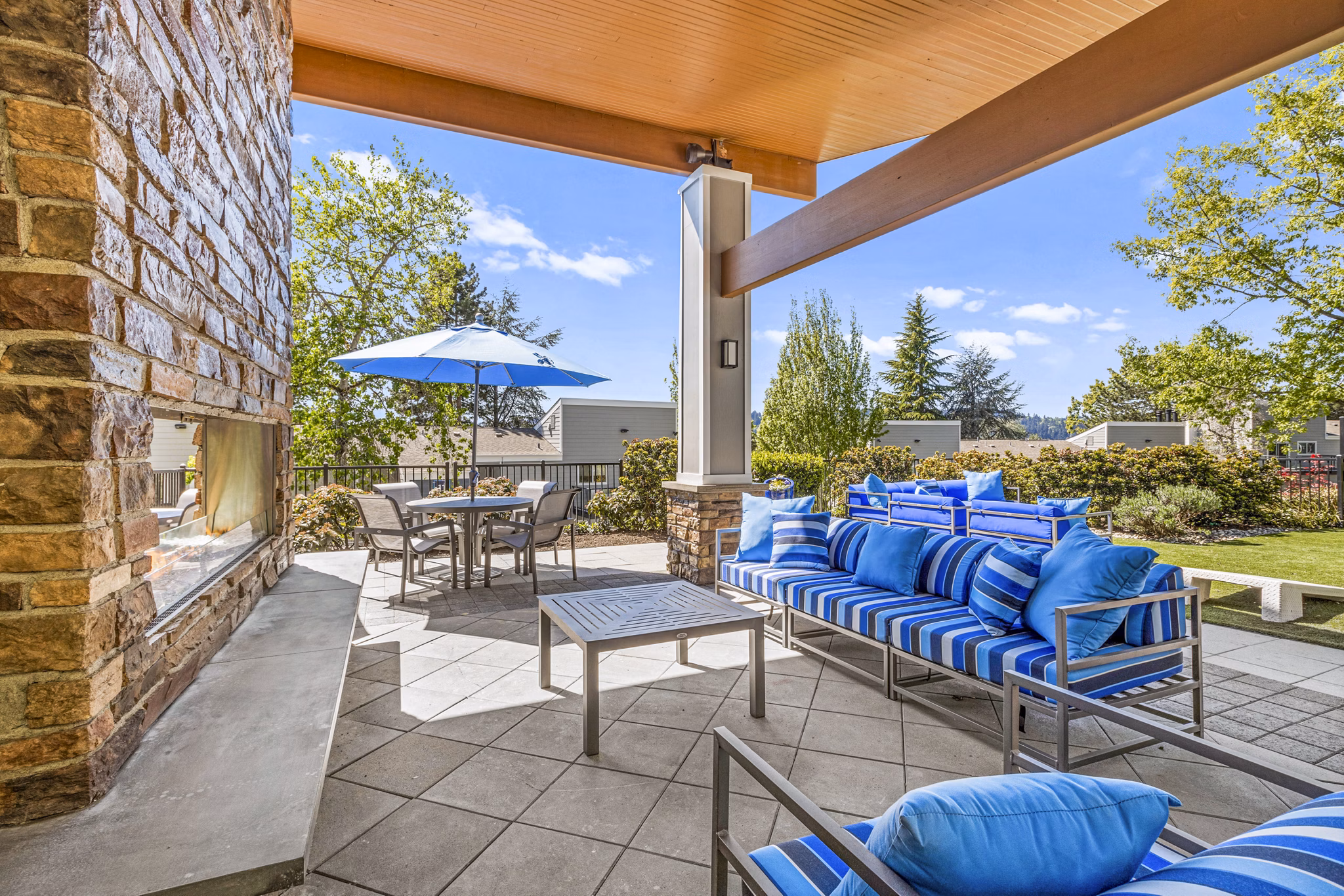 Outdoor fire pit patio at Lakeview at Newcastle Apartments, ideal for social gatherings and relaxation