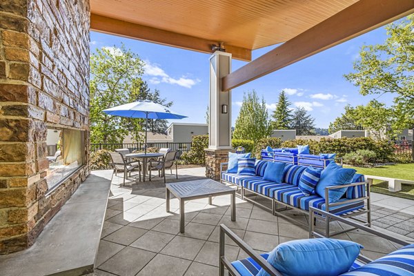 Outdoor fire pit patio at Lakeview at Newcastle Apartments, ideal for social gatherings and relaxation
