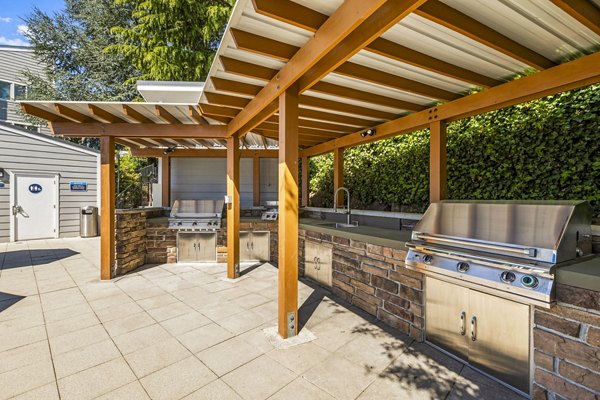 Grill and seating area on patio at Lakeview at Newcastle Apartments