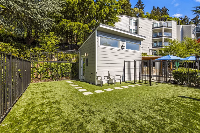 Inviting pool entrance at Lakeview at Newcastle Apartments featuring modern landscaping and seating areas