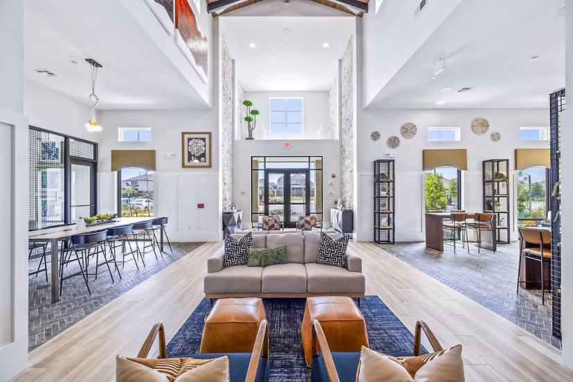 Clubhouse lobby with modern seating and decor at Elan Harvest Green Apartments, offering luxurious community spaces in Richmond