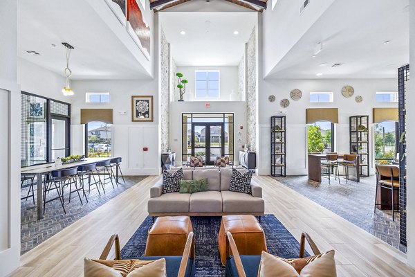 Clubhouse lobby with modern seating and decor at Elan Harvest Green Apartments, offering luxurious community spaces in Richmond