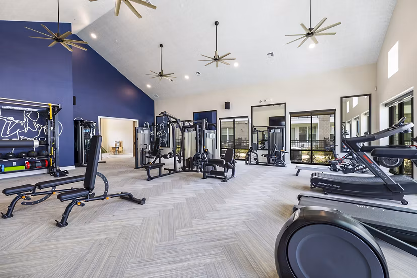 Spacious fitness center with modern equipment at Elan Harvest Green Apartments