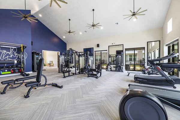 Spacious fitness center with modern equipment at Elan Harvest Green Apartments