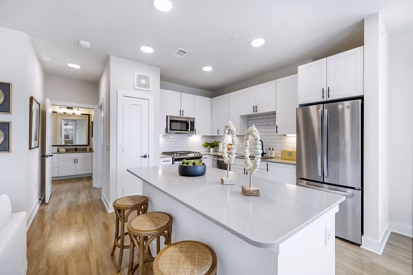 Modern kitchen with stainless steel appliances at Elan Harvest Green Apartments