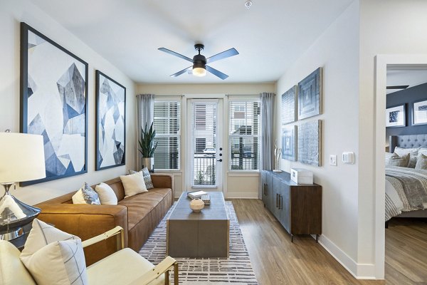 Modern living room with chic furnishings at Elan Harvest Green Apartments