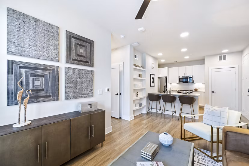 Elan Harvest Green Apartments: Open-plan living room with cozy seating and modern decor
