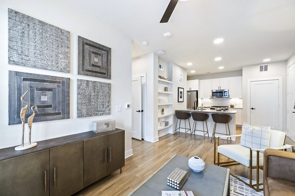 Elan Harvest Green Apartments: Open-plan living room with cozy seating and modern decor
