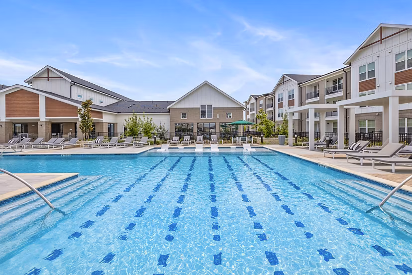 Sparkling outdoor pool at Elan Harvest Green Apartments, ideal for relaxation and leisure activities