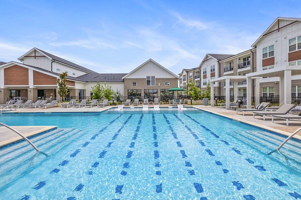 Sparkling outdoor pool at Elan Harvest Green Apartments, ideal for relaxation and leisure activities