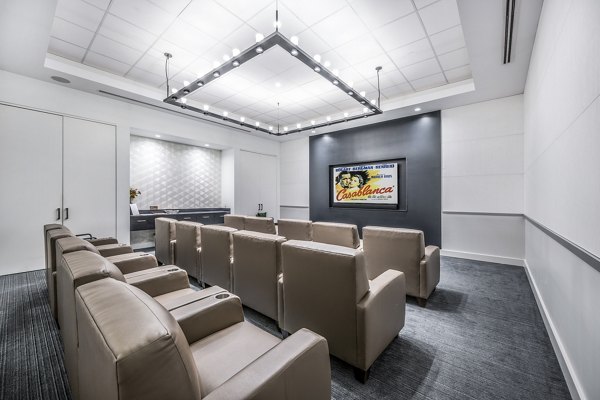 Clubhouse theater with comfortable seating at Avenu at Natick Apartments, perfect for movie nights and social gatherings