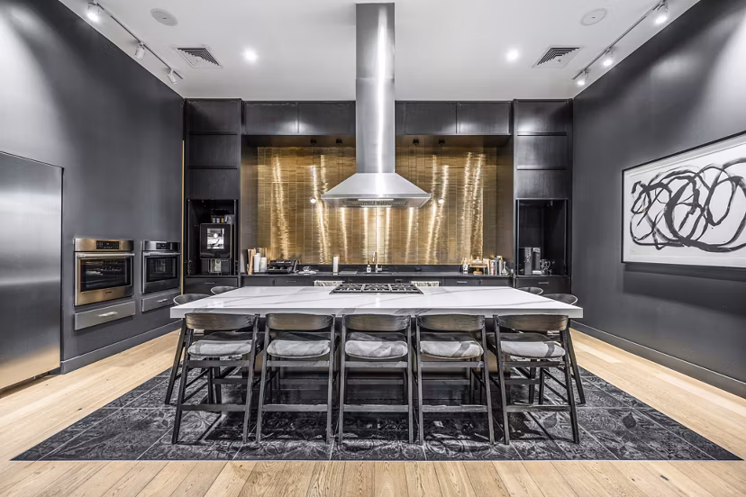 Modern clubhouse kitchen with stainless steel appliances at Avenu at Natick Apartments
