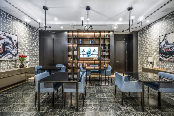 Elegant dining room featuring contemporary decor and ample seating at Avenu at Natick Apartments clubhouse