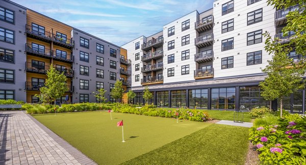 putting green at Avenu at Natick Apartments