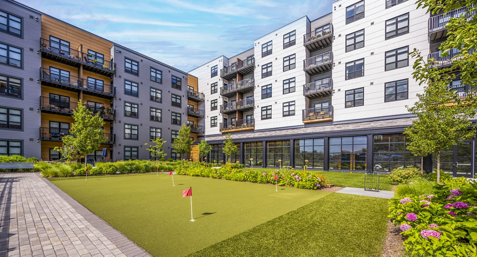 Avenu at Natick: Scenic putting green at luxury apartments offering leisure activities