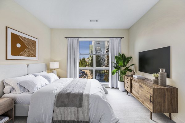 Bedroom featuring modern design and cozy decor in One North of Boston Apartments