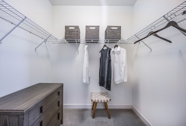 Bedroom closet with custom shelving at One North of Boston Apartments