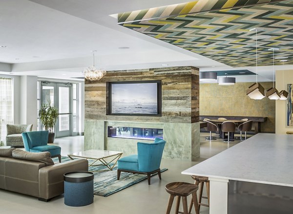 Modern clubhouse with sleek design at One North of Boston Apartments Features include lounge areas and meeting rooms for residents