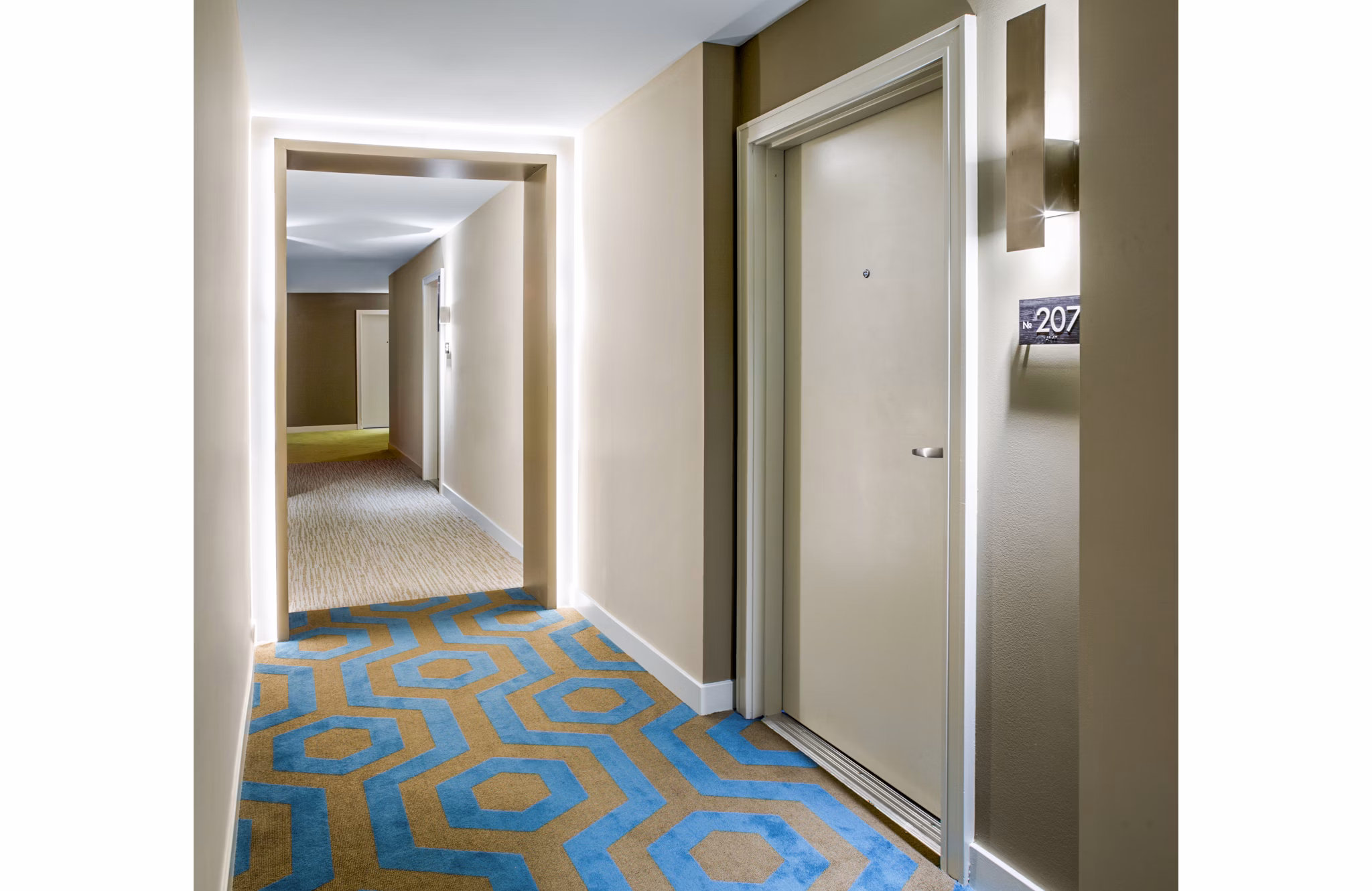 Bright hallway with modern lighting and art in One North of Boston Apartments