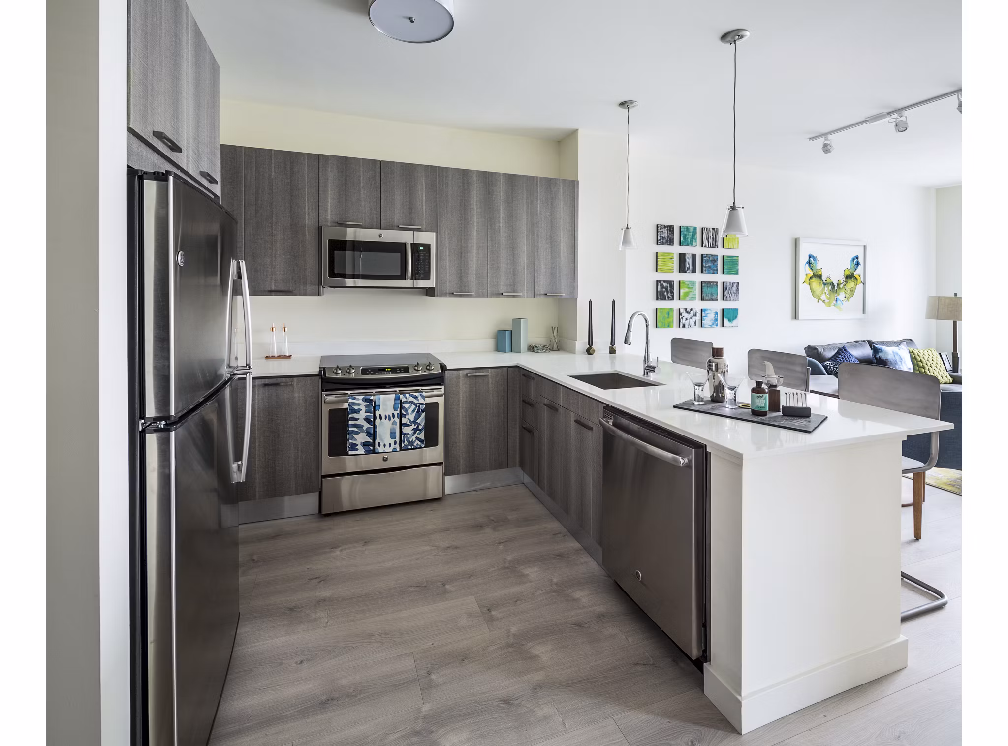 Modern kitchen with stainless steel appliances at One North of Boston Apartments