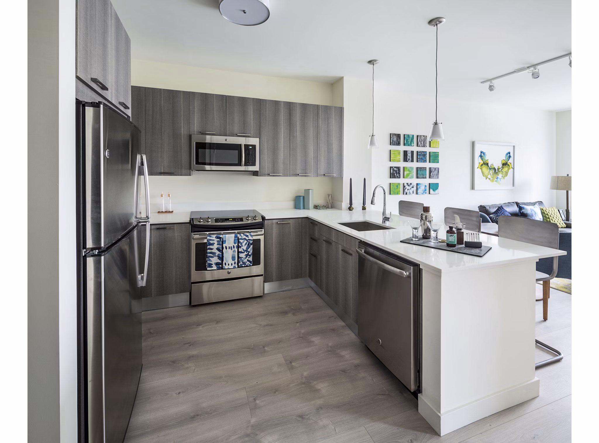 Modern kitchen with stainless steel appliances at One North of Boston Apartments