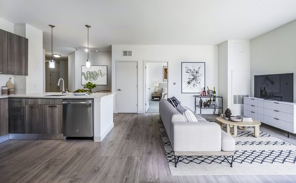 Spacious living room with modern furnishings at One North of Boston Apartments