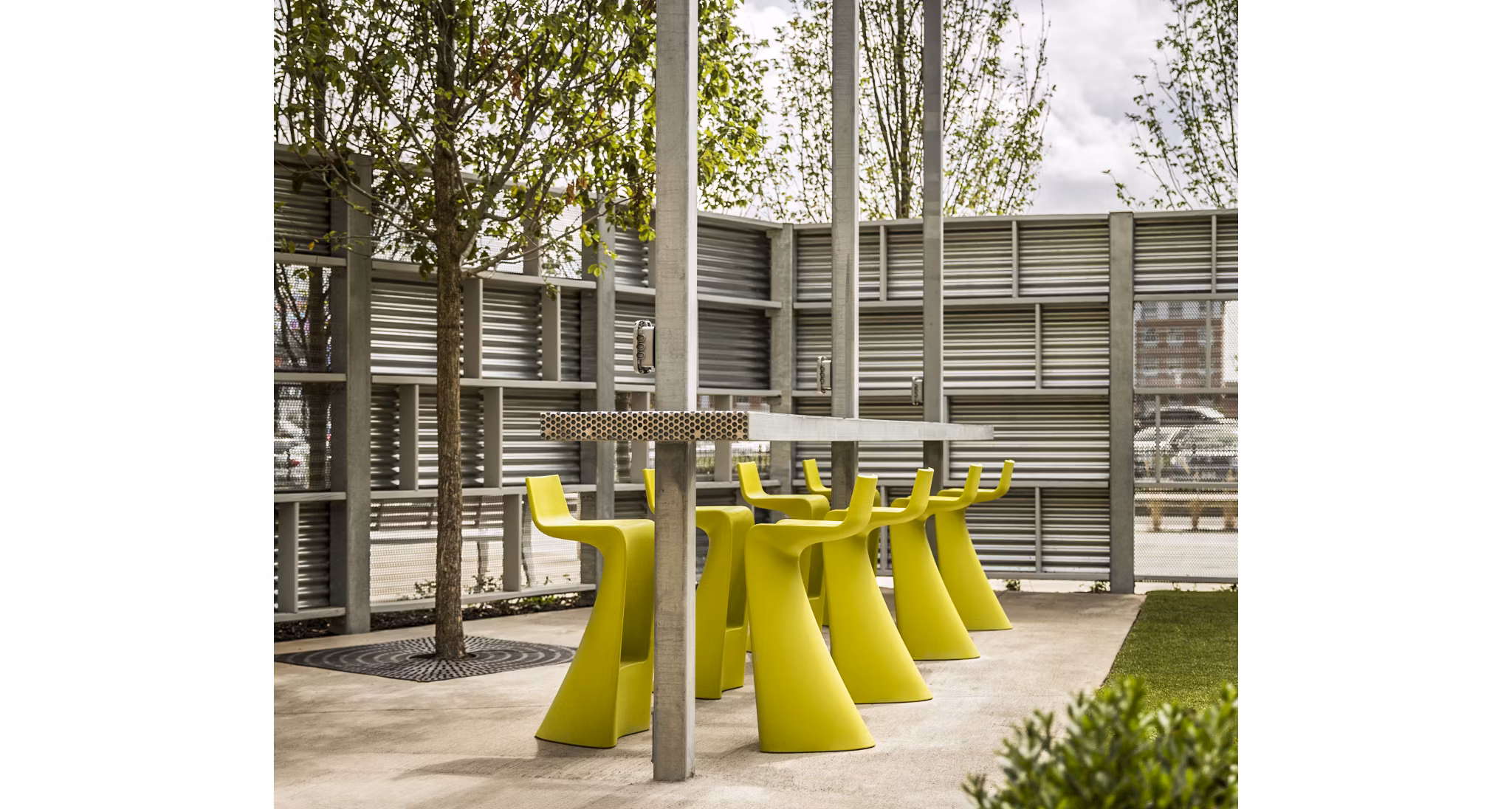 Patio with seating and outdoor lighting at One North of Boston Apartments