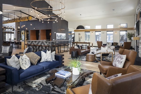 Clubhouse with modern design at Broadstone Wren Apartments featuring luxurious seating and entertainment areas