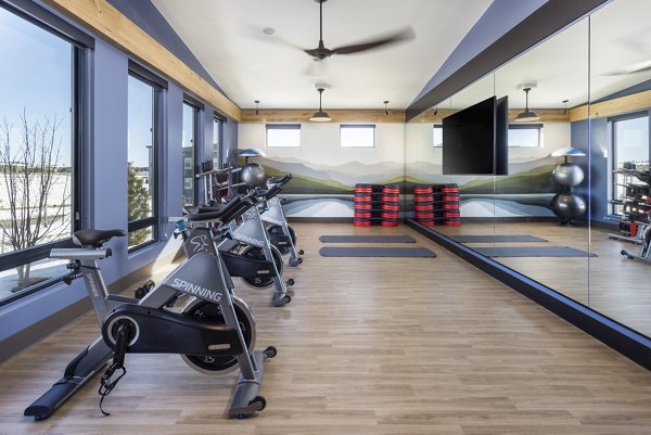 Yoga/spin studio with modern equipment at Broadstone Wren Apartments, ideal for fitness enthusiasts seeking luxury living