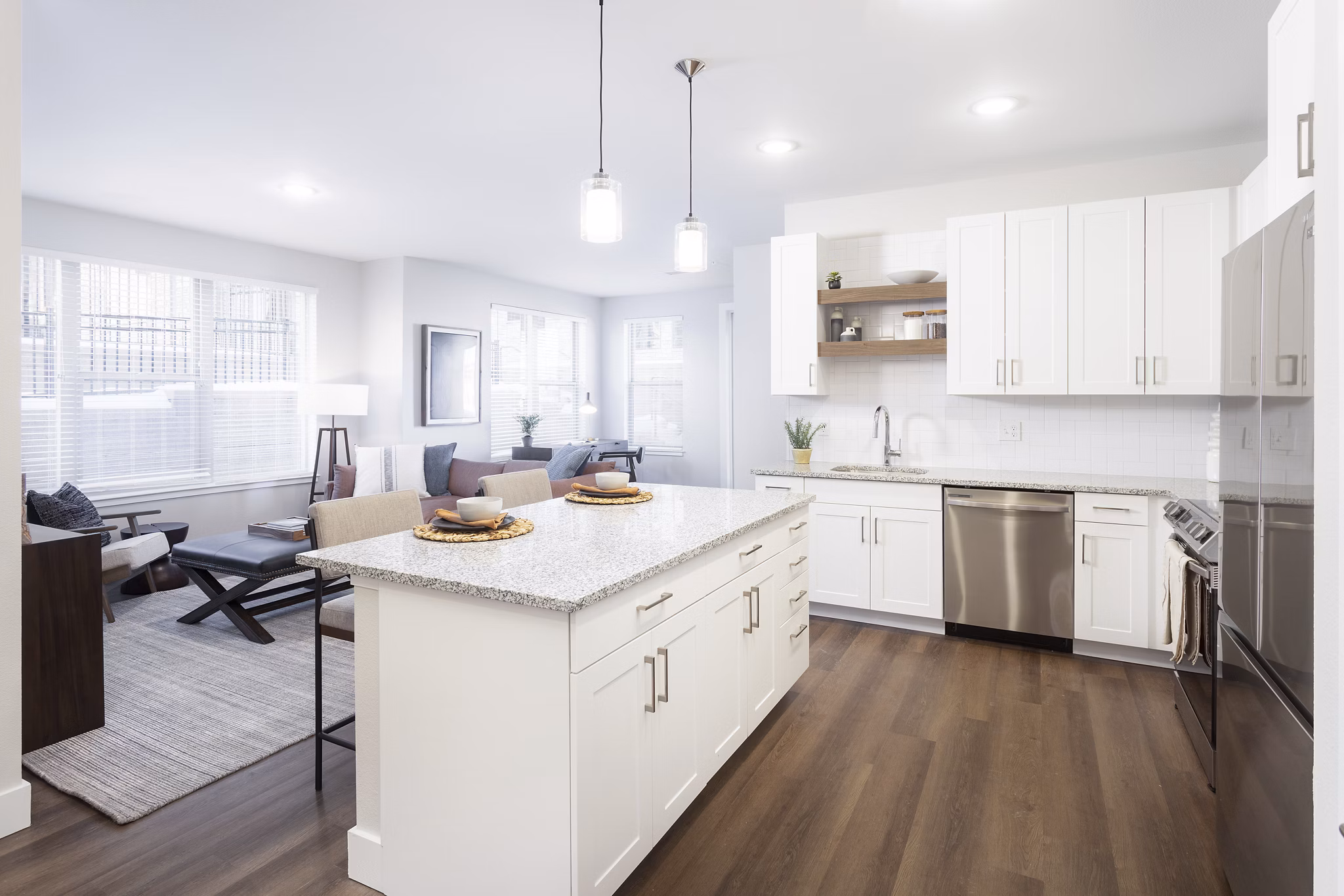 Modern kitchen with sleek stainless steel appliances at Broadstone Wren Apartments