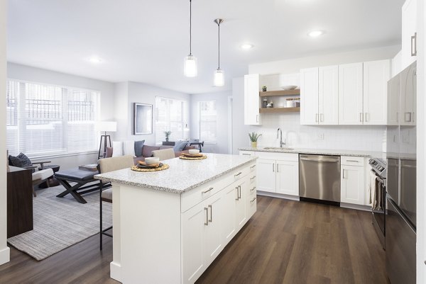 Modern kitchen with sleek stainless steel appliances at Broadstone Wren Apartments