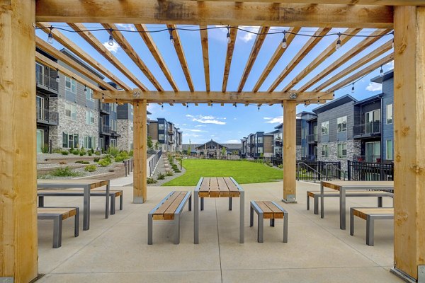Broadstone Wren Apartments: Inviting courtyard with lush greenery and seating areas in a serene urban setting