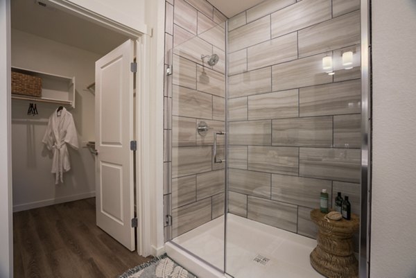Modern bathroom with elegant fixtures at Allaso Journal Center Apartments