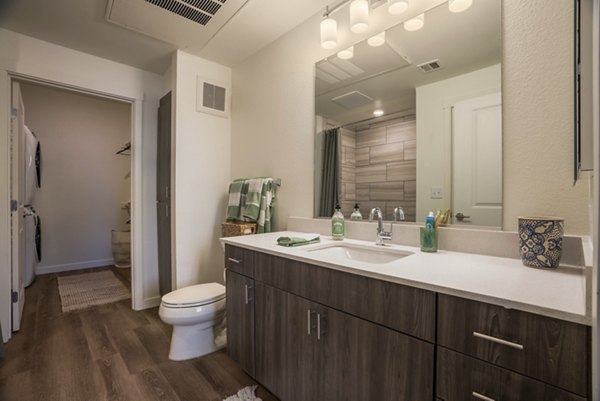Modern bathroom with sleek fixtures in Allaso Journal Center Apartments