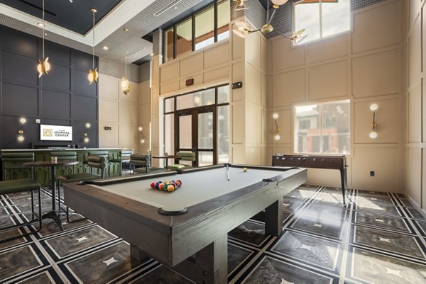 Clubhouse featuring modern design and seating areas at Allaso Journal Center Apartments, a luxury apartment community