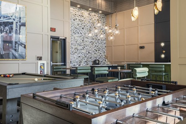 Clubhouse with modern design and cozy seating at Allaso Journal Center Apartments: luxury living experience