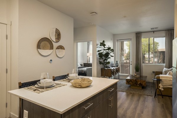 Elegant dining area with modern furnishings at Allaso Journal Center Apartments offering luxury living