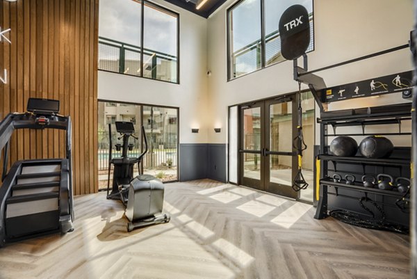 State-of-the-art fitness center with advanced equipment at Allaso Journal Center Apartments