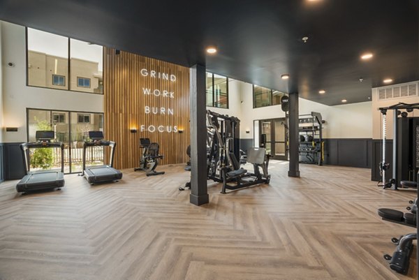 Modern fitness center featuring state-of-the-art equipment at Allaso Journal Center Apartments