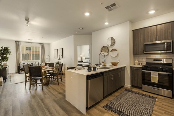 Modern kitchen with stainless steel appliances at Allaso Journal Center Apartments