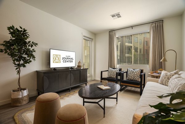 Spacious living room with modern decor in Allaso Journal Center Apartments