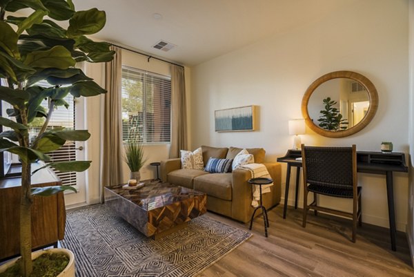 Modern living room with stylish decor at Allaso Journal Center Apartments