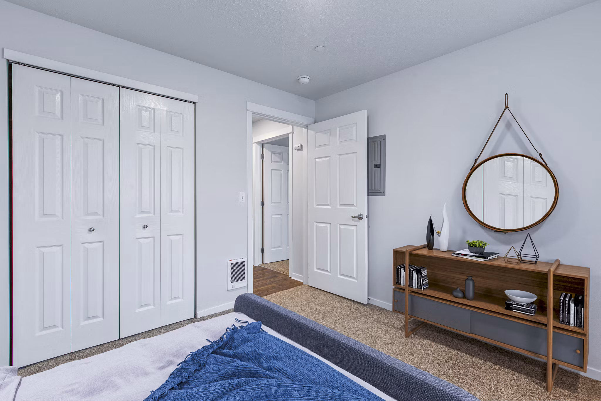 Cozy bedroom with modern decor and ample natural light at Trillium Apartments