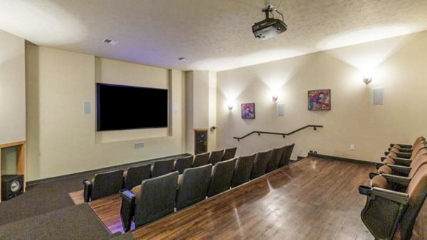 Clubhouse theater featuring plush seating and large screen at Trillium Apartments