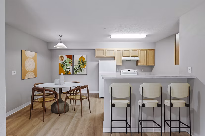 Modern kitchen with stainless steel appliances in Trillium Apartments