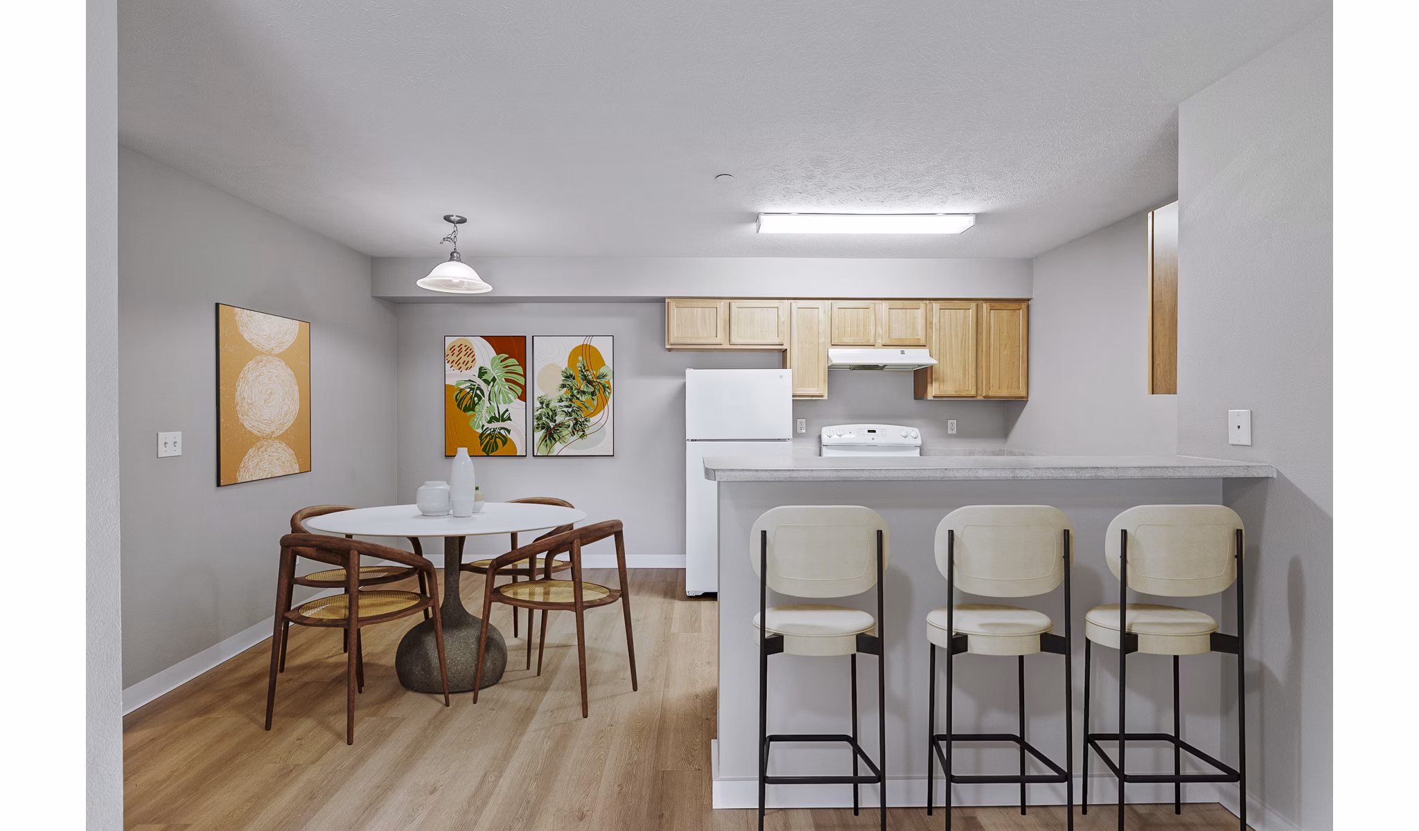 Modern kitchen with stainless steel appliances in Trillium Apartments