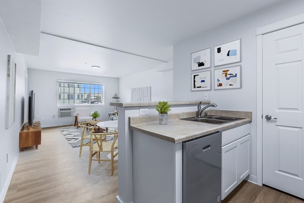 Spacious kitchen featuring stainless steel appliances at Trillium Apartments