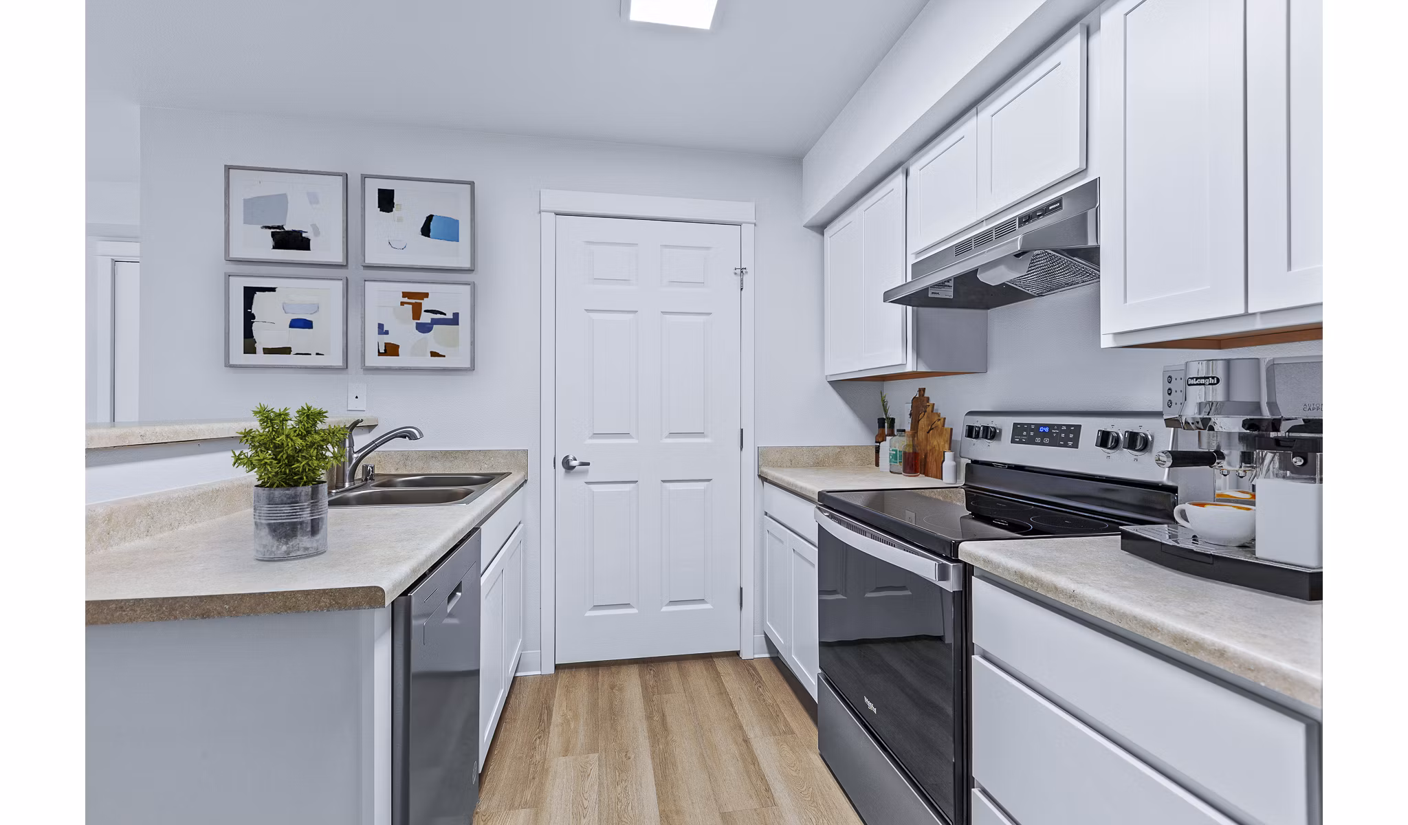 Modern kitchen featuring stainless steel appliances at Trillium Apartments