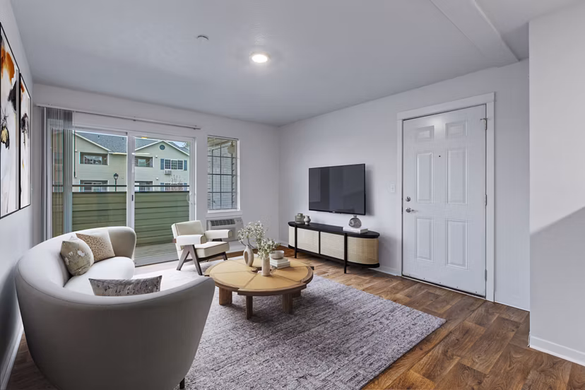 Modern living room with chic furnishings at Trillium Apartments, showcasing luxury and comfort in a stylish setting